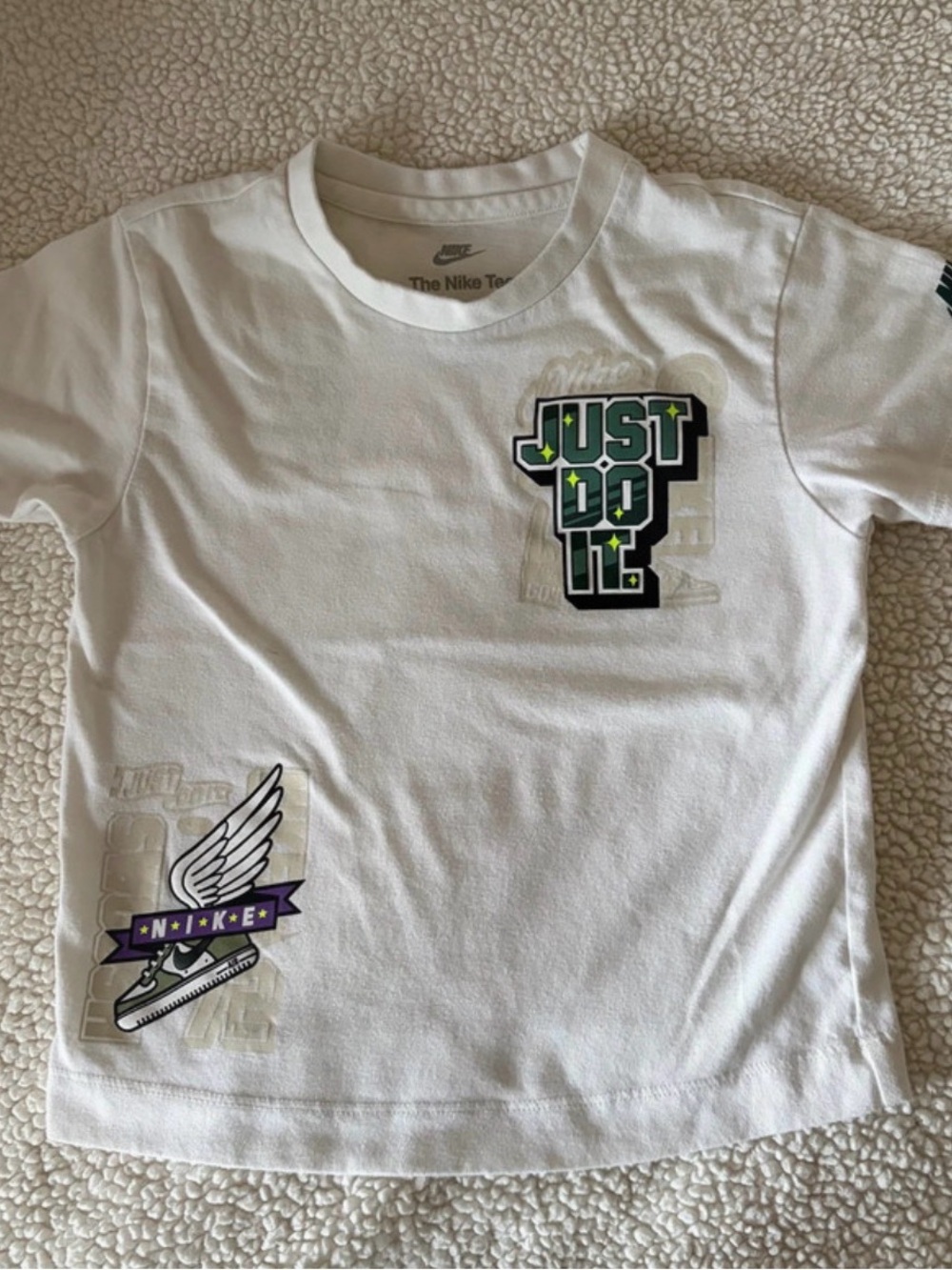 Nike White Kids' Short Sleeve Tee with 'Just Do It' Graphic and Winged Sneaker